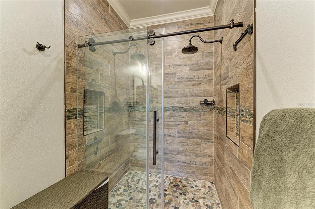 8015 Limestone Lane, Unit 15101 Sarasota, FL 34233 - Photo 22 of 46 a bathroom with a shower