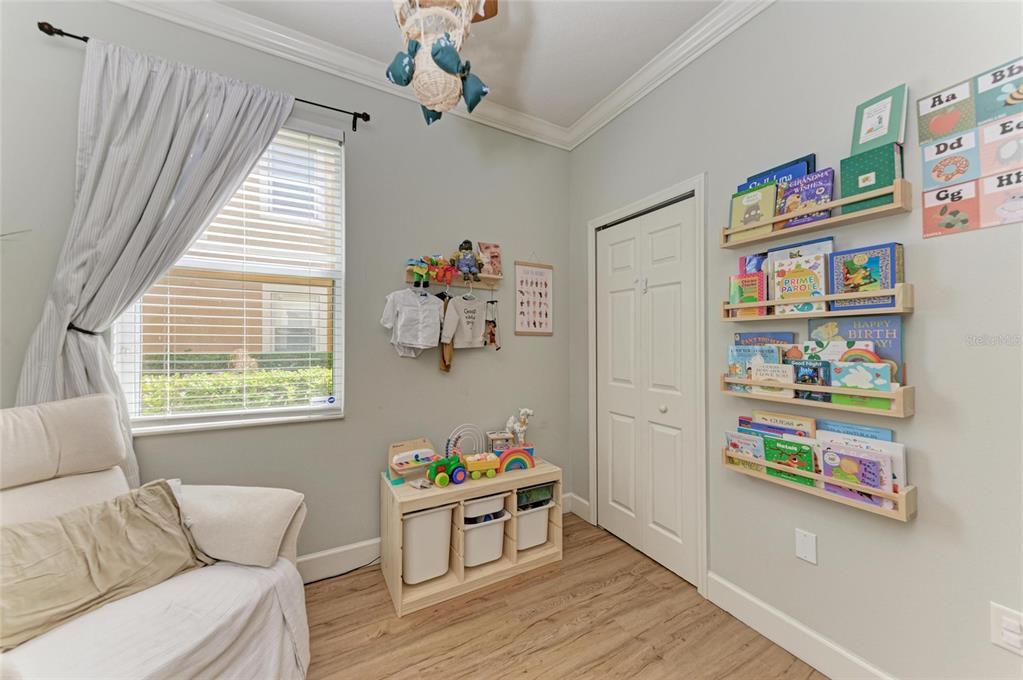 8015 Limestone Lane, Unit 15101 Sarasota, FL 34233 - Photo 24 of 46 a living room with furniture and a window