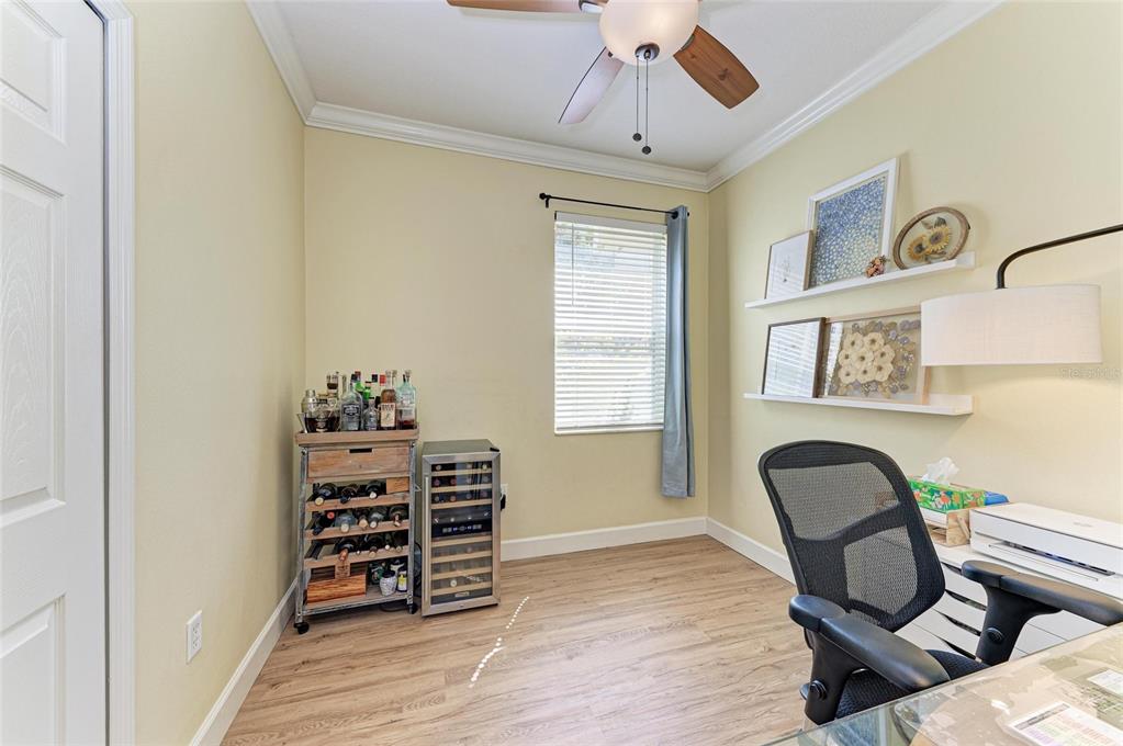 8015 Limestone Lane, Unit 15101 Sarasota, FL 34233 - Photo 25 of 46 a view of a workspace with furniture and a window