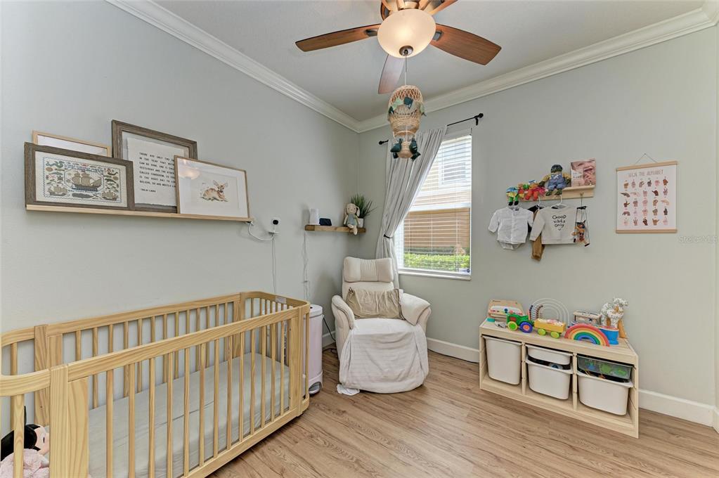 8015 Limestone Lane, Unit 15101 Sarasota, FL 34233 - Photo 27 of 46 a bedroom with furniture and a window