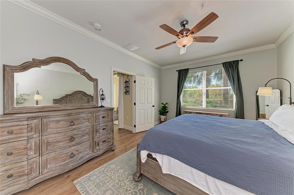 8015 Limestone Lane, Unit 15101 Sarasota, FL 34233 - Photo 4 of 46 a bedroom with a bed and window