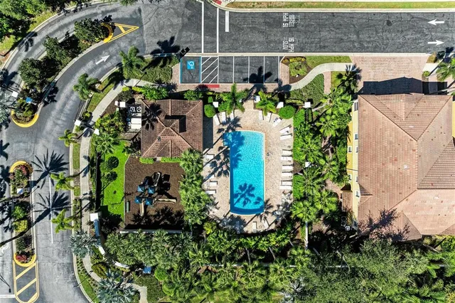 an aerial view of a house with a yard and garden