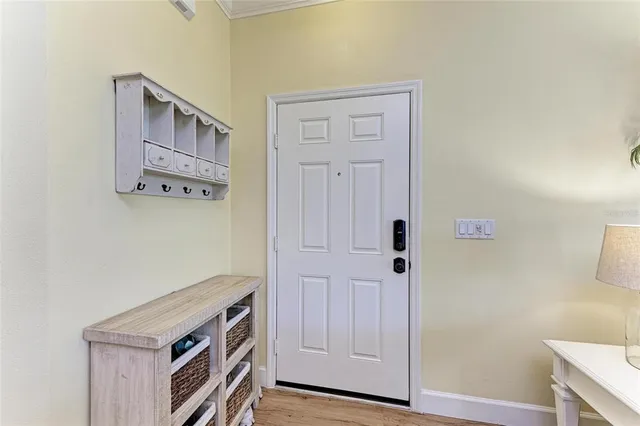 a view of an entryway with cabinets