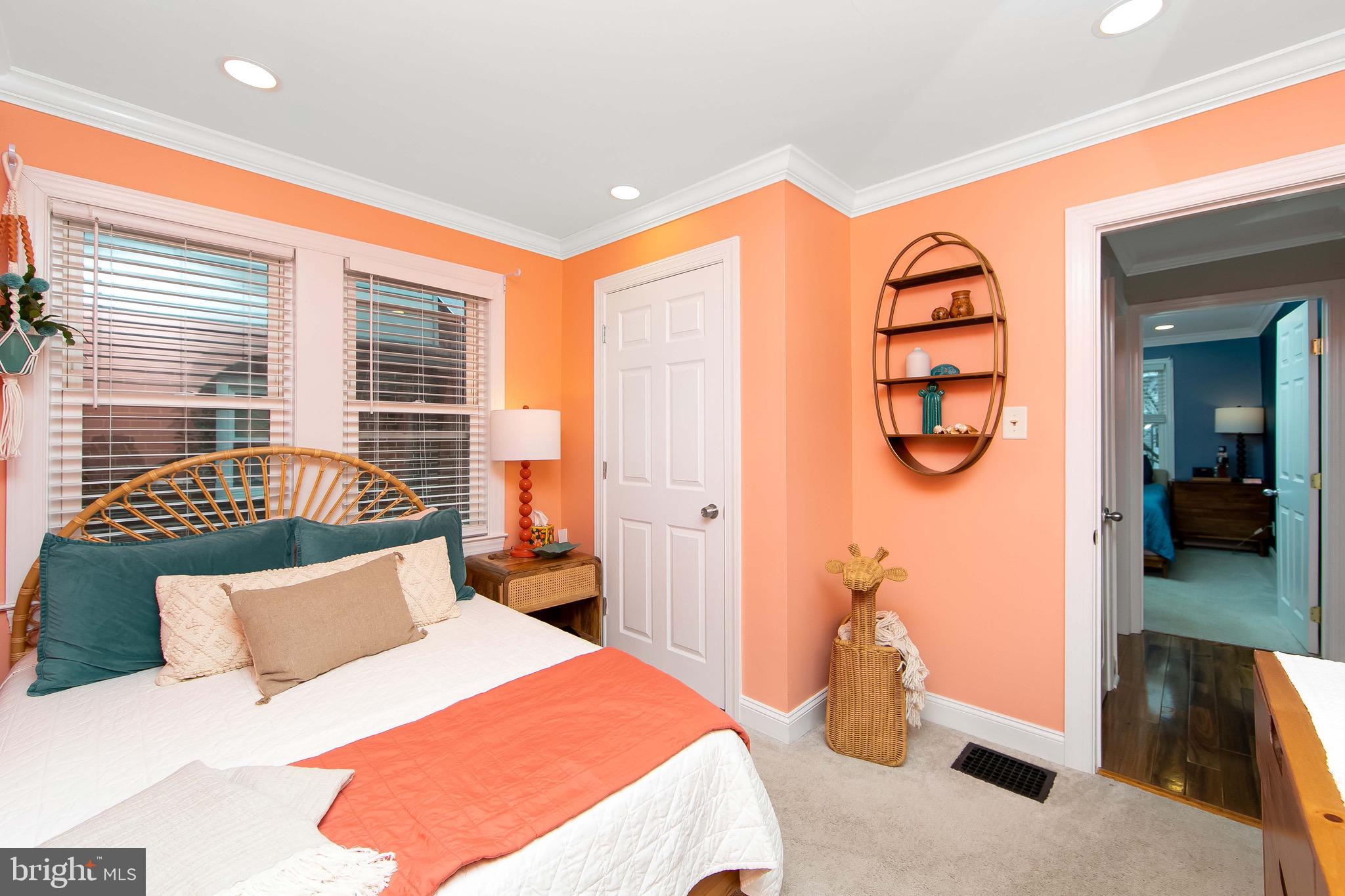 22 West 6th Avenue Runnemede, NJ 08078 - Photo 18 of 33 a bedroom with a large bed and a chandelier