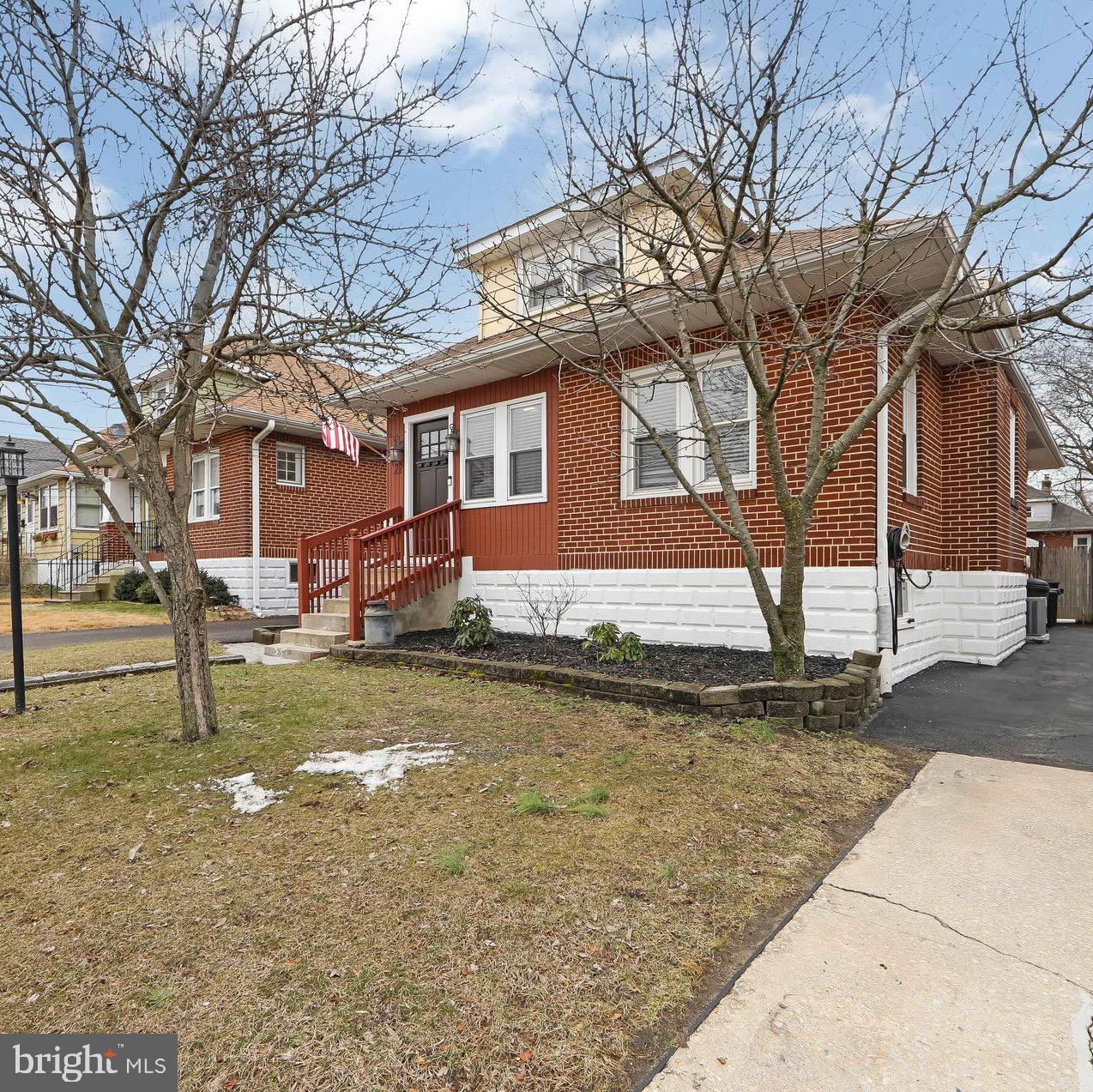 22 West 6th Avenue Runnemede, NJ 08078 - Photo 4 of 33 a front view of a house with a yard