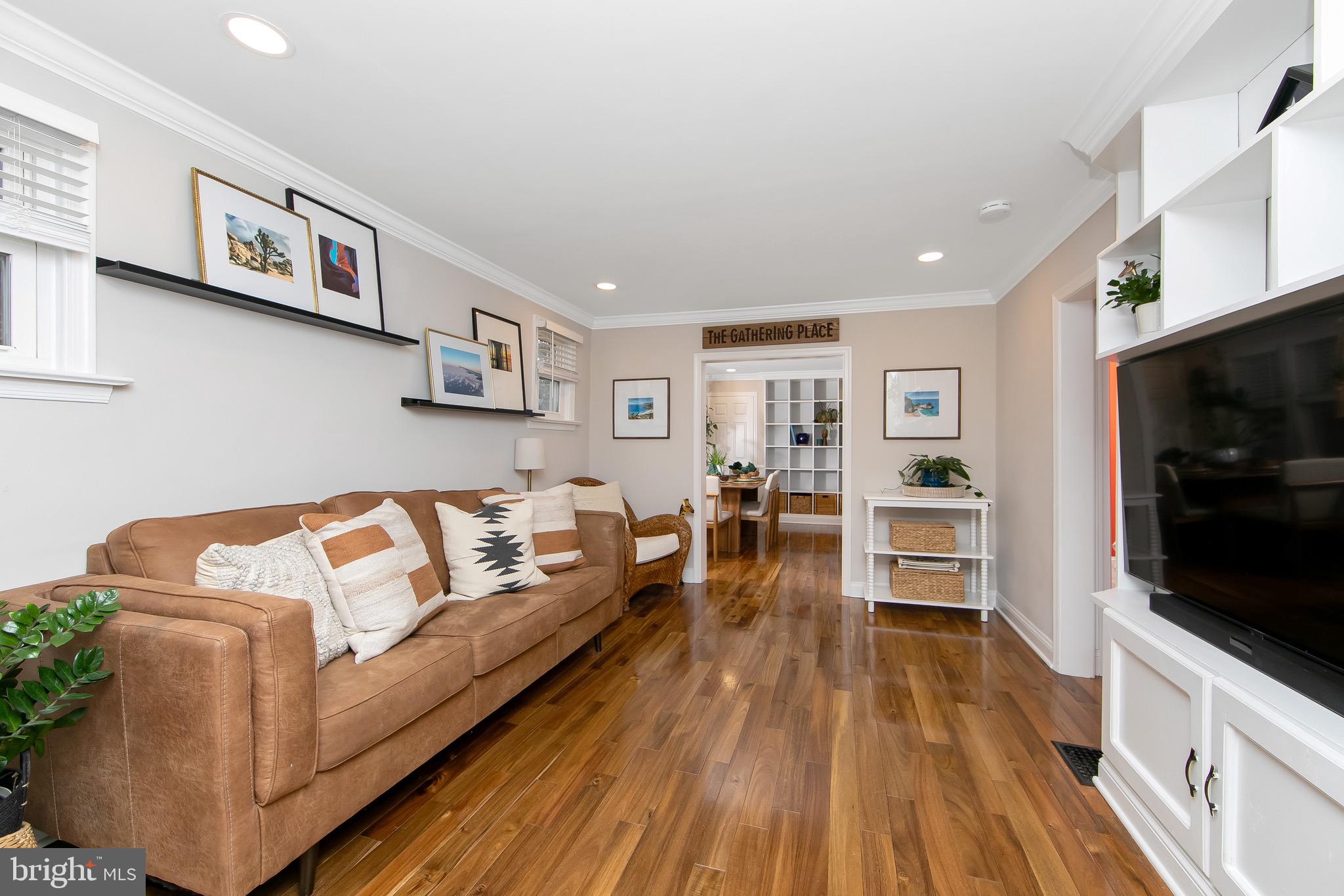 22 West 6th Avenue Runnemede, NJ 08078 - Photo 8 of 33 a living room with furniture and a flat screen tv