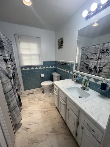 a bedroom with a bed and couch