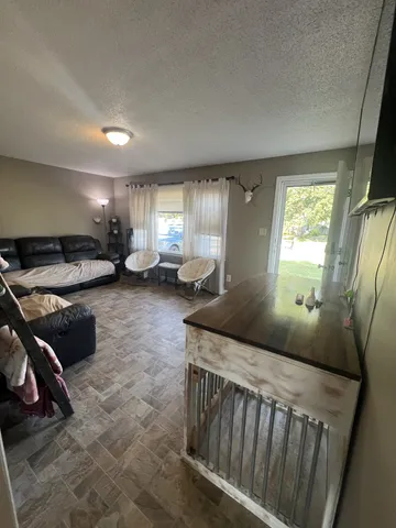 a bedroom with furniture and a window