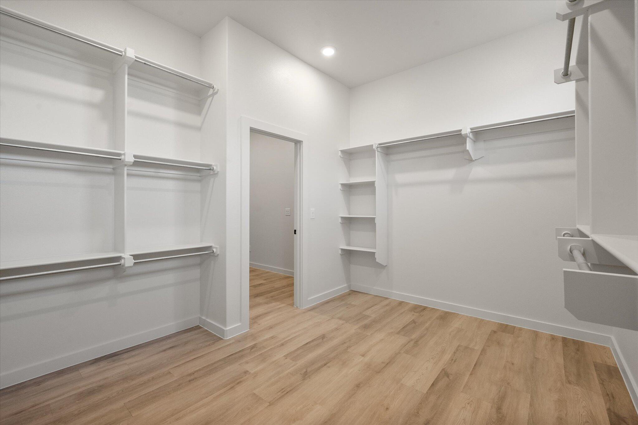 7010 16th Street Lubbock, TX 79416 - Photo 20 of 28 a view of an empty walk in closet with empty racks