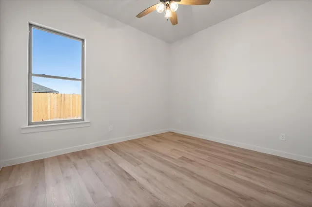 an empty room with a empty space and a window