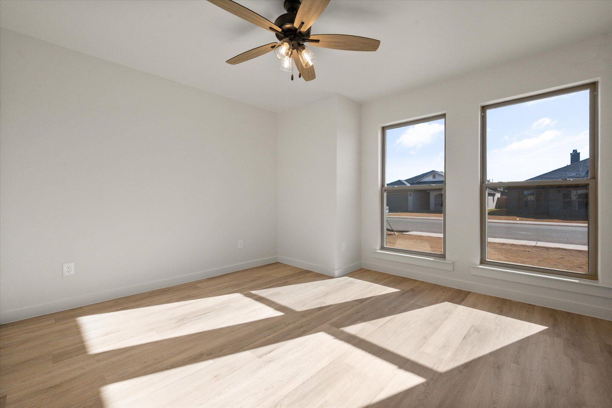 7010 16th Street Lubbock, TX 79416 - Photo 23 of 28 a view of an empty room with a window