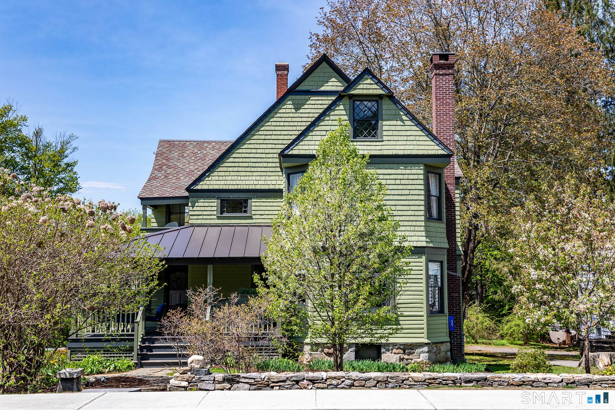 35 Maple Avenue Norfolk, CT 06058 - Photo 1 of 40 a front view of a house with a yard