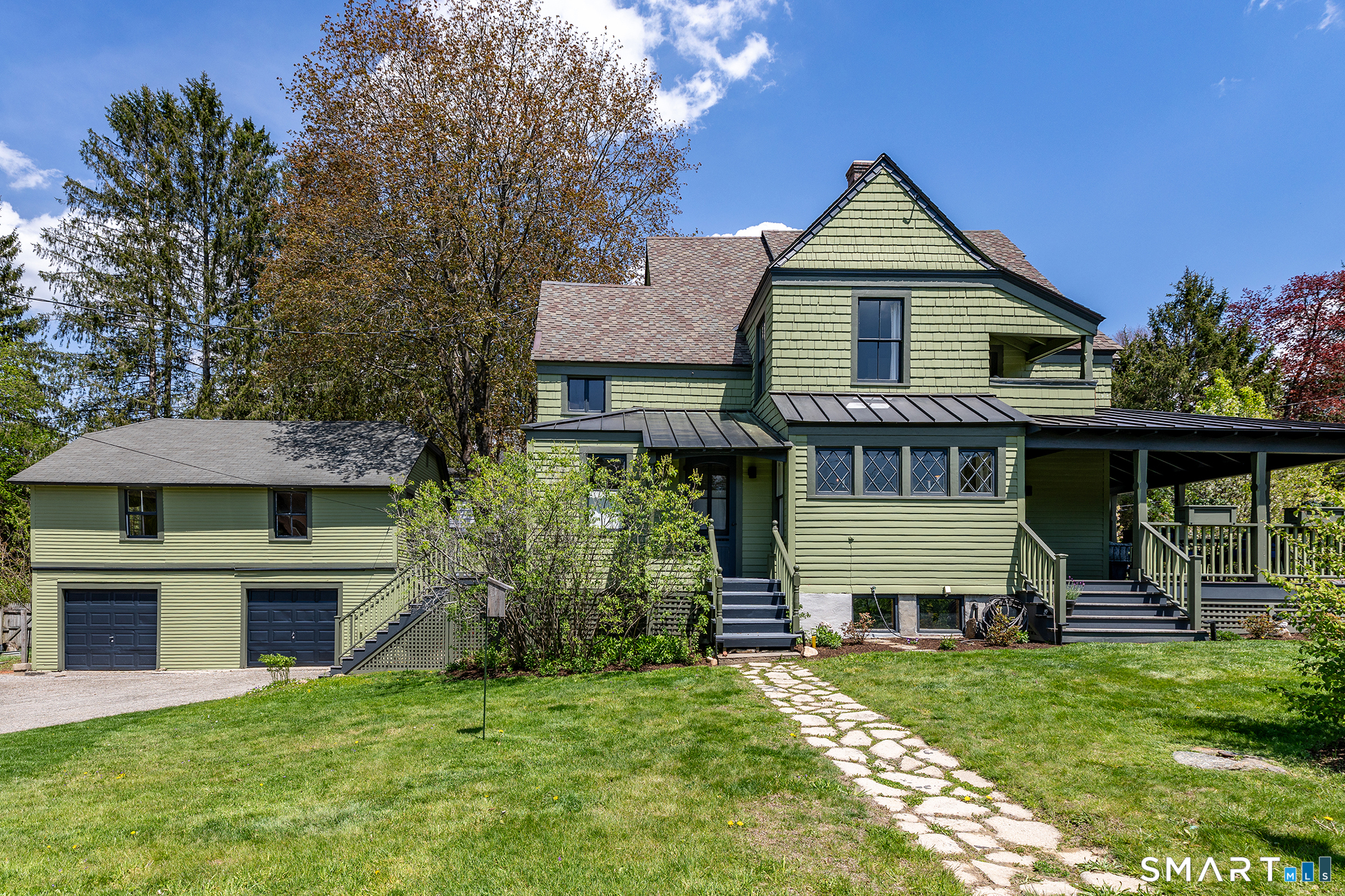 35 Maple Avenue Norfolk, CT 06058 - Photo 2 of 40 a front view of a house with a yard