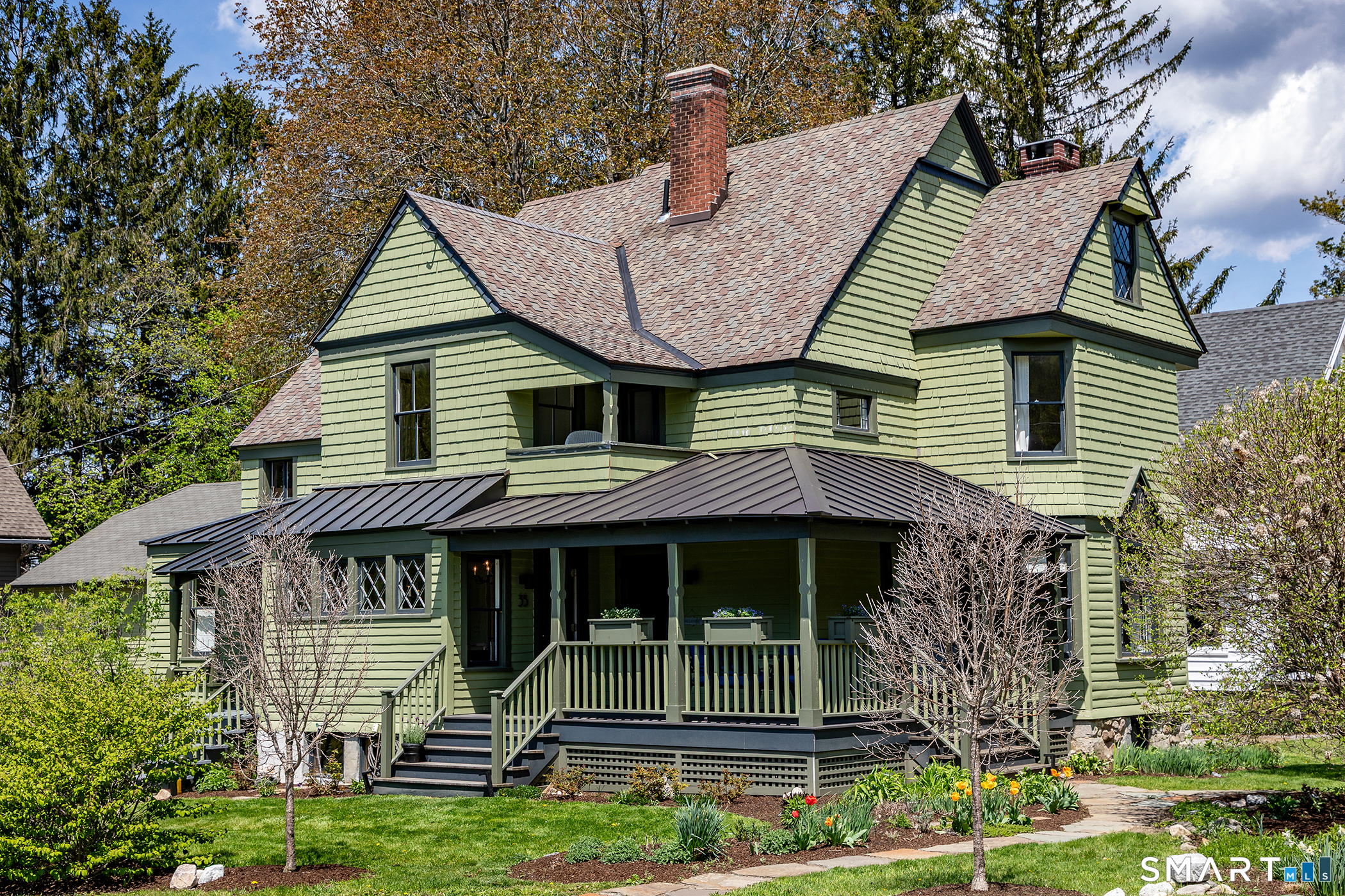 35 Maple Avenue Norfolk, CT 06058 - Photo 40 of 40 a front view of a house with a garden