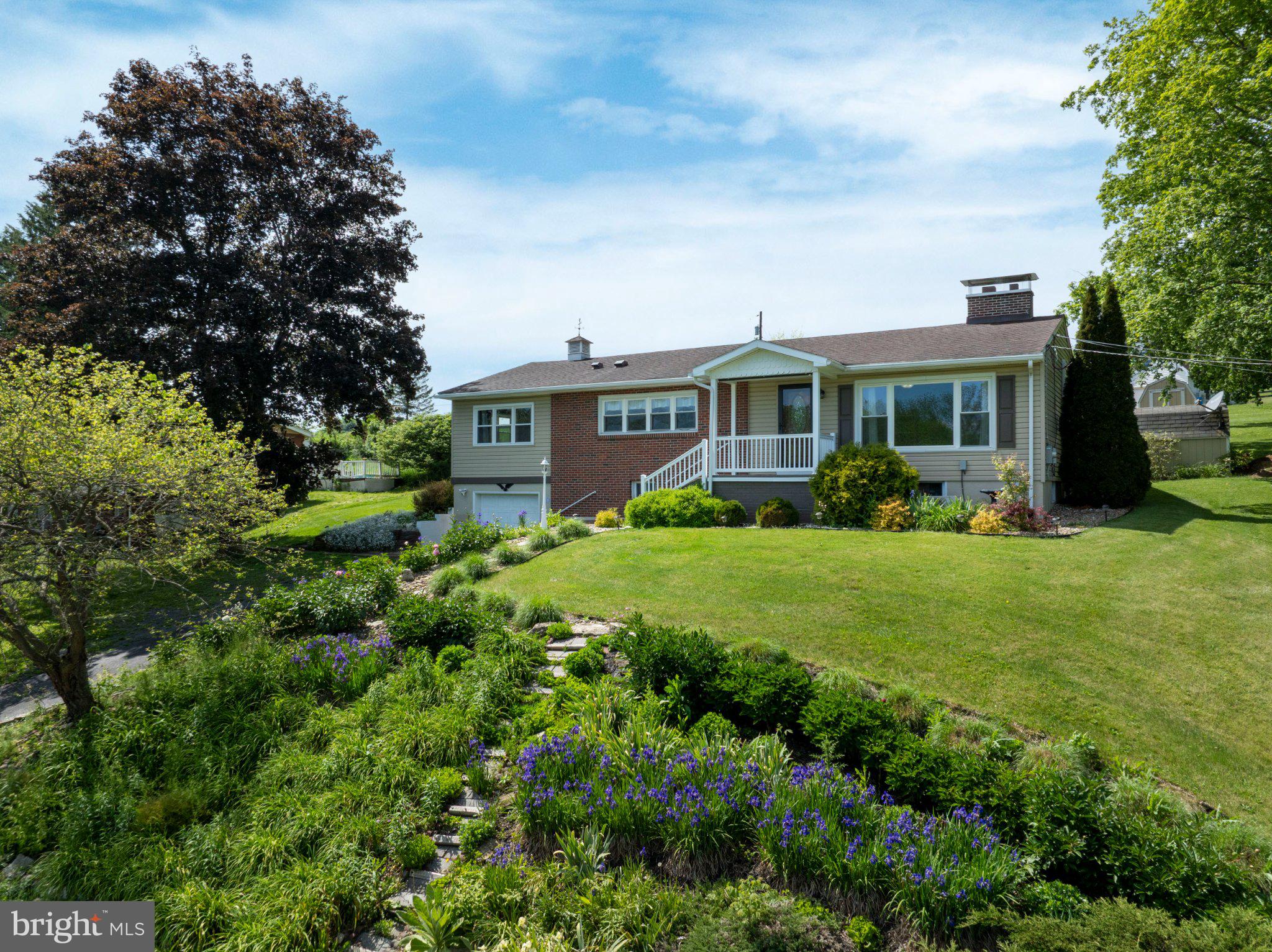 Charming home with lush gardens.