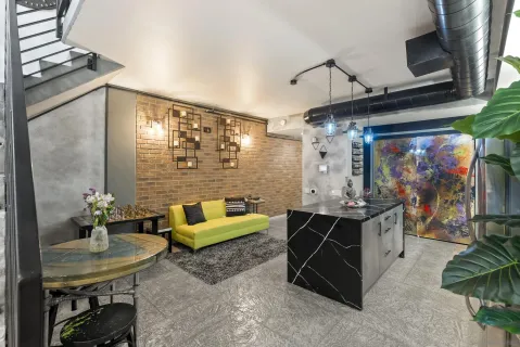 a view of a livingroom with washer and dryer