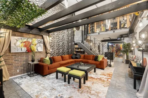 a outdoor living space with patio furniture and a fireplace