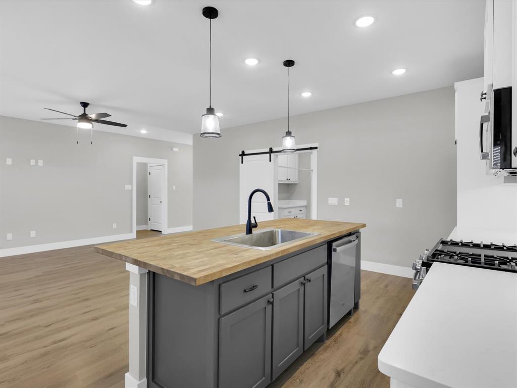 4905 Sweetbay Road Sherman, TX 75092 - Photo 6 of 26 a spacious bathroom with a sink a mirror and a shower