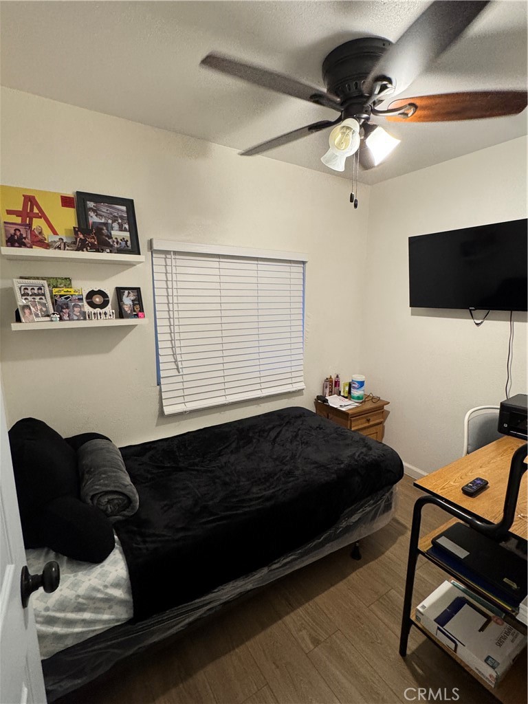 2751 Reche Canyon Road, Unit 70 Moreno Valley, CA 92555 - Photo 3 of 4 a living room with a couch and a flat screen tv