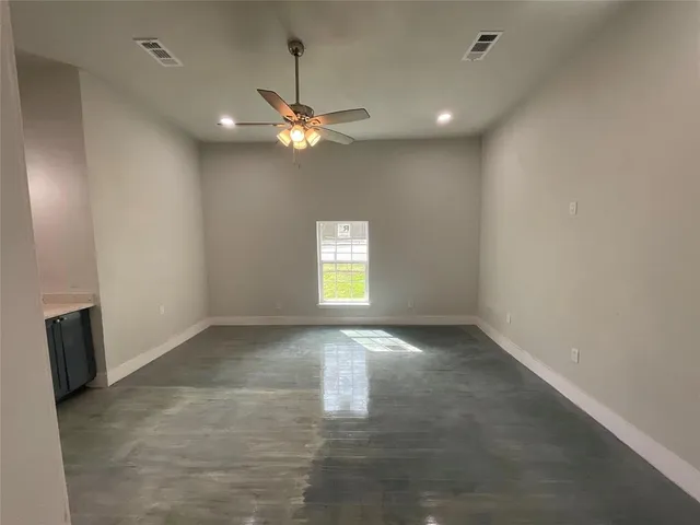 an empty room with a empty space and a window