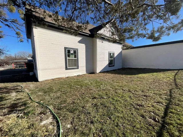 a view of a backyard of a house