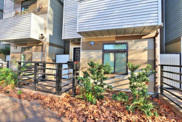 front view of a house with a small yard