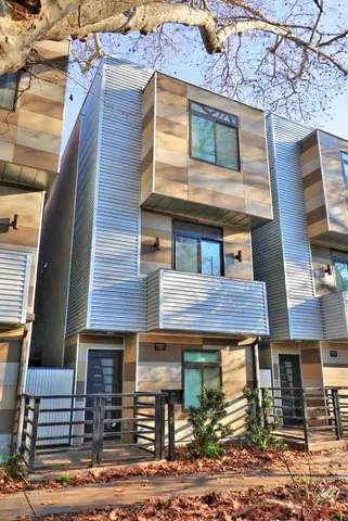 a red brick house with large windows