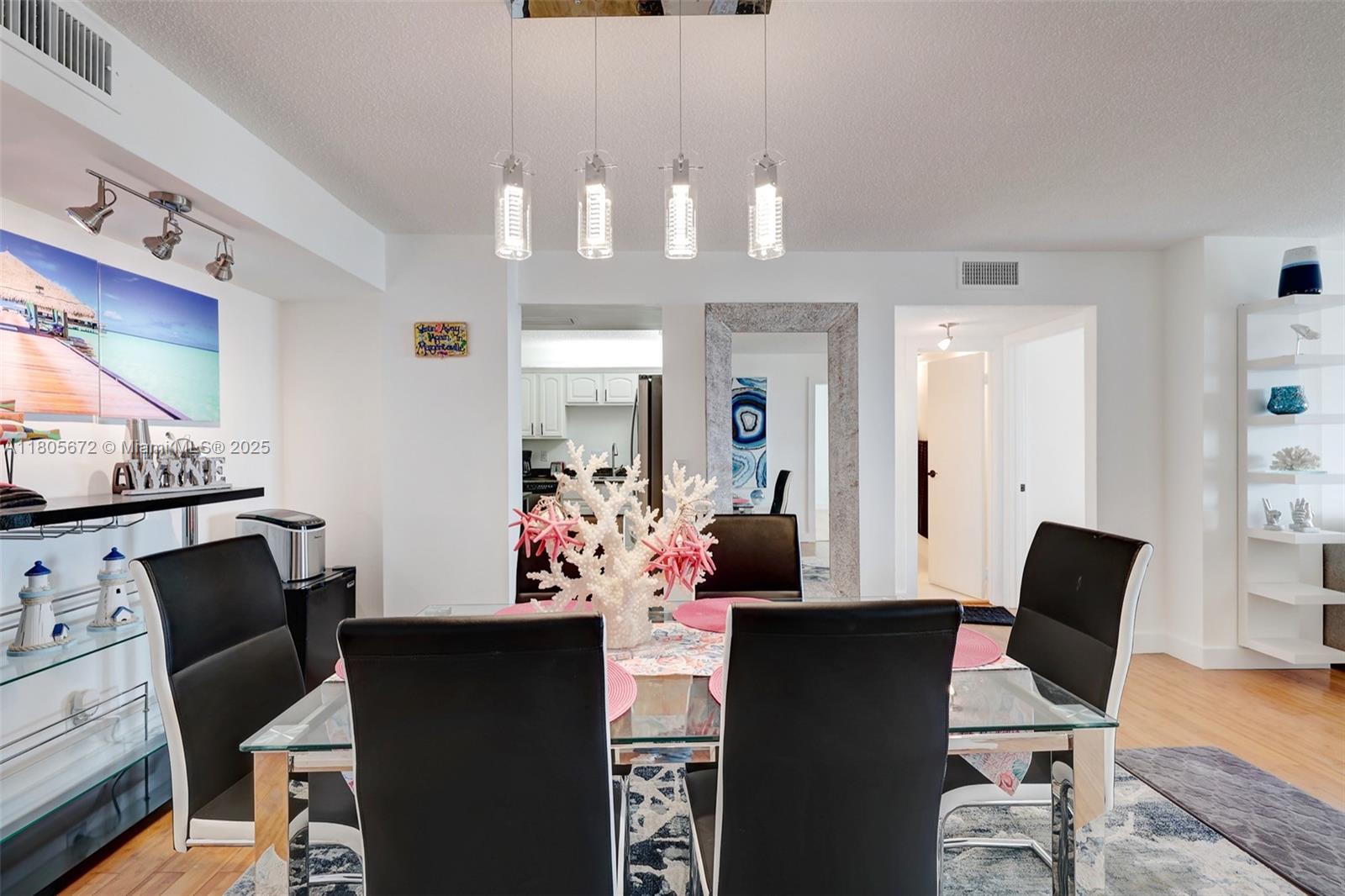 1500 South Ocean Drive, Unit 7J Hollywood, FL 33019 - Photo 14 of 54 a view of a dining room with furniture and wooden floor