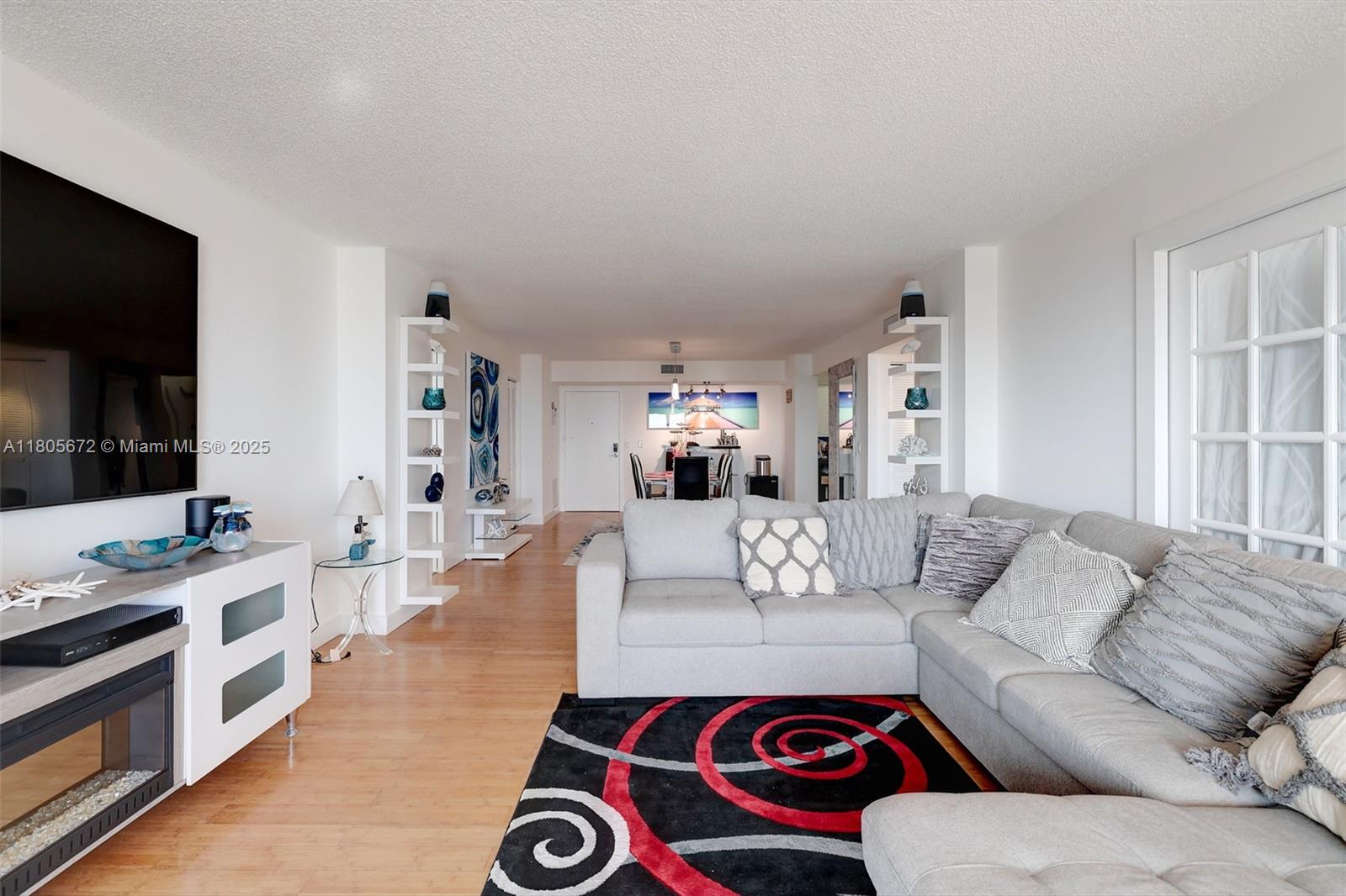 1500 South Ocean Drive, Unit 7J Hollywood, FL 33019 - Photo 16 of 54 a living room with furniture and a flat screen tv