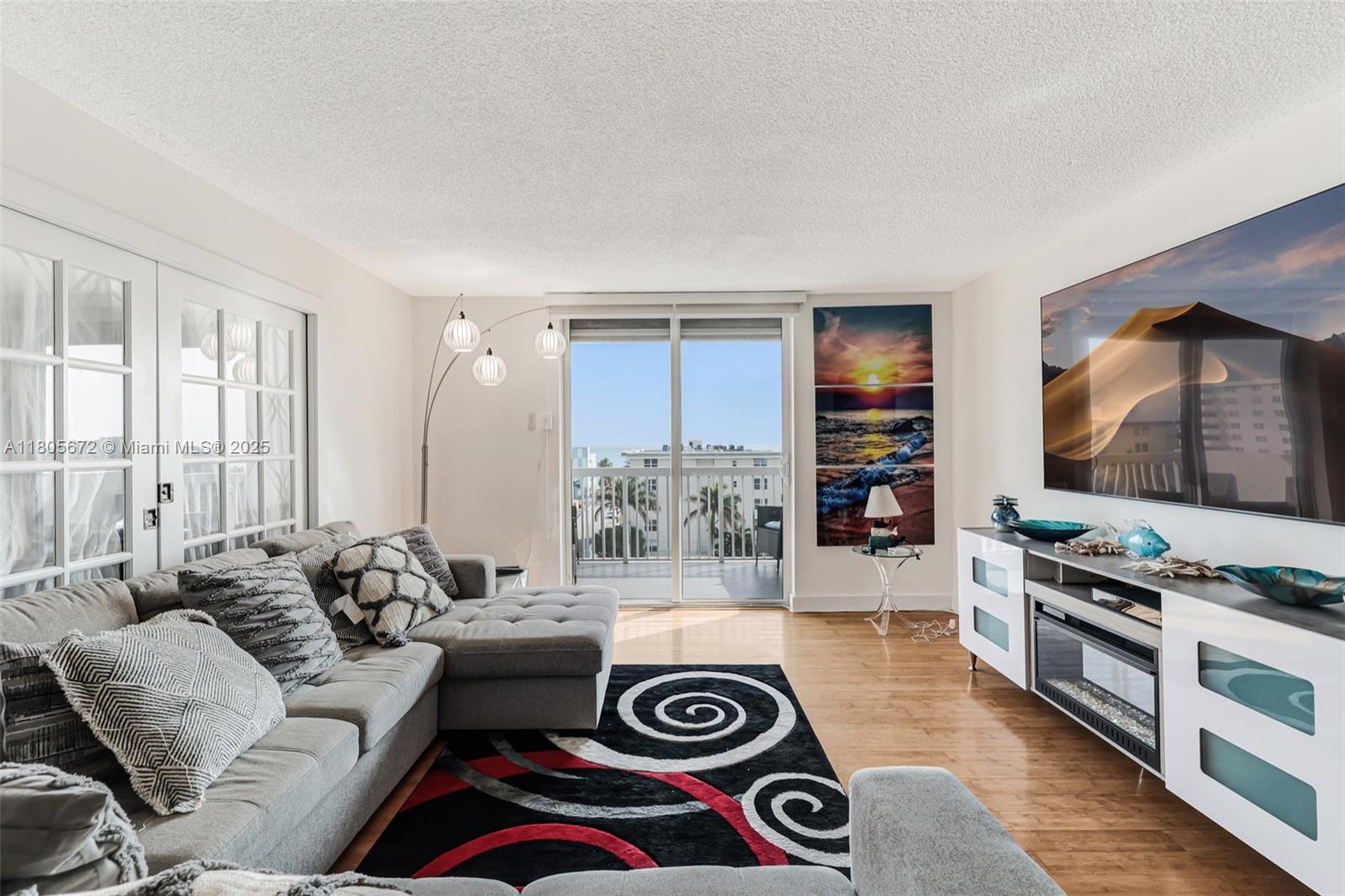 1500 South Ocean Drive, Unit 7J Hollywood, FL 33019 - Photo 18 of 54 a living room with furniture and a flat screen tv