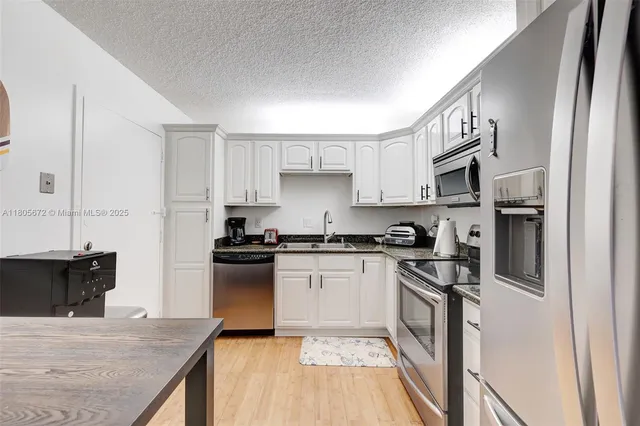 a bedroom with a large bed and a couch