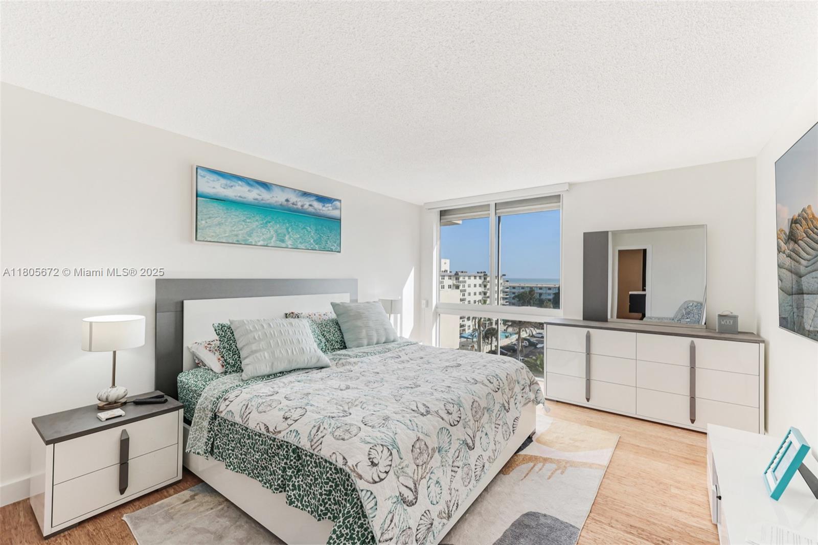 1500 South Ocean Drive, Unit 7J Hollywood, FL 33019 - Photo 23 of 54 a bedroom with a large bed and a couch