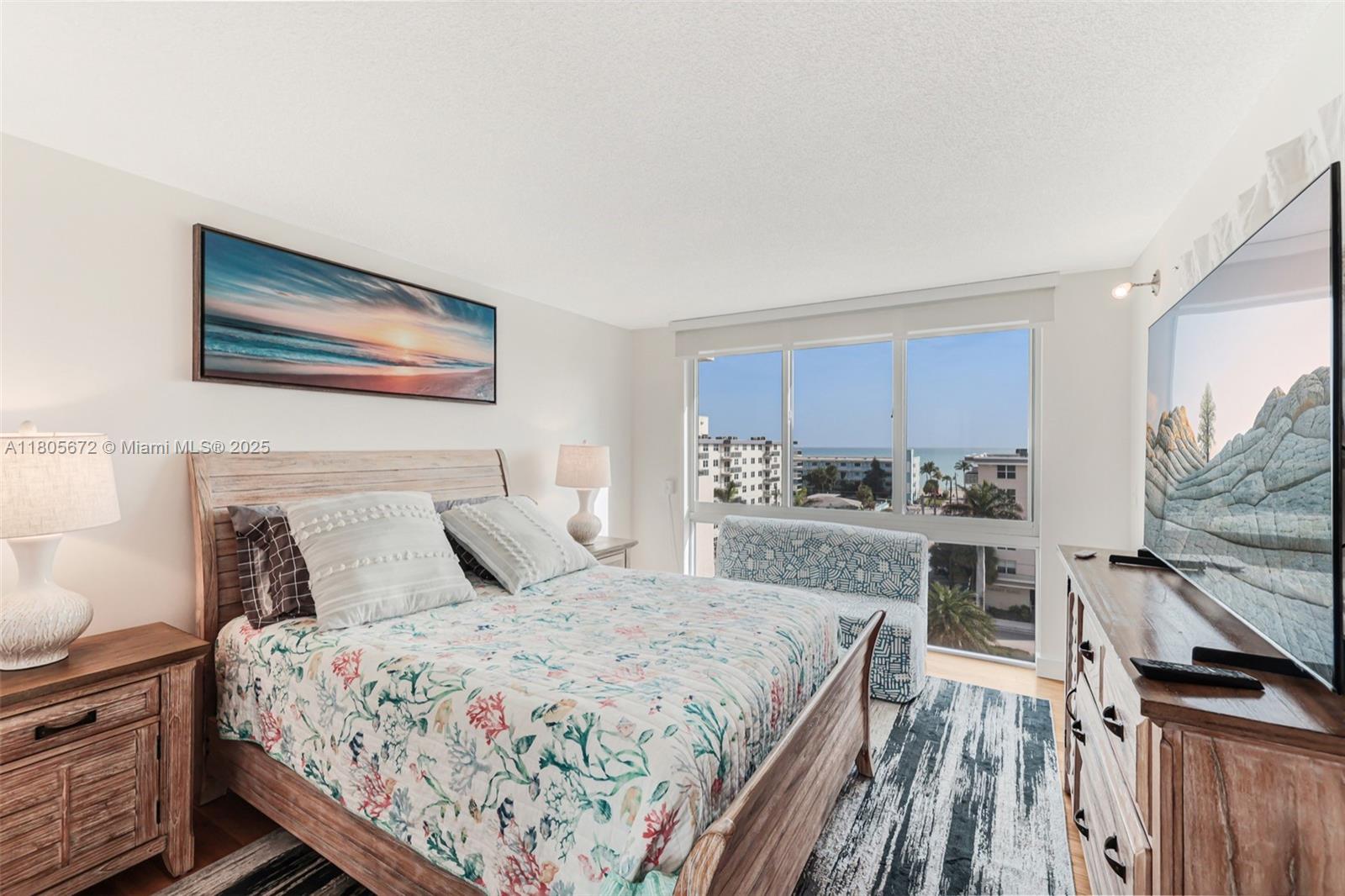 1500 South Ocean Drive, Unit 7J Hollywood, FL 33019 - Photo 28 of 54 a bedroom with a bed and a dresser next to a window