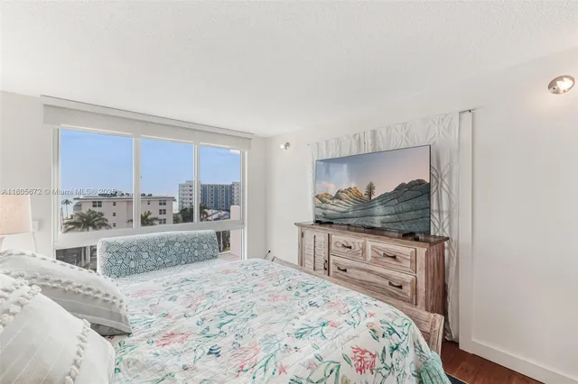 a view of a living room and a floor to ceiling window