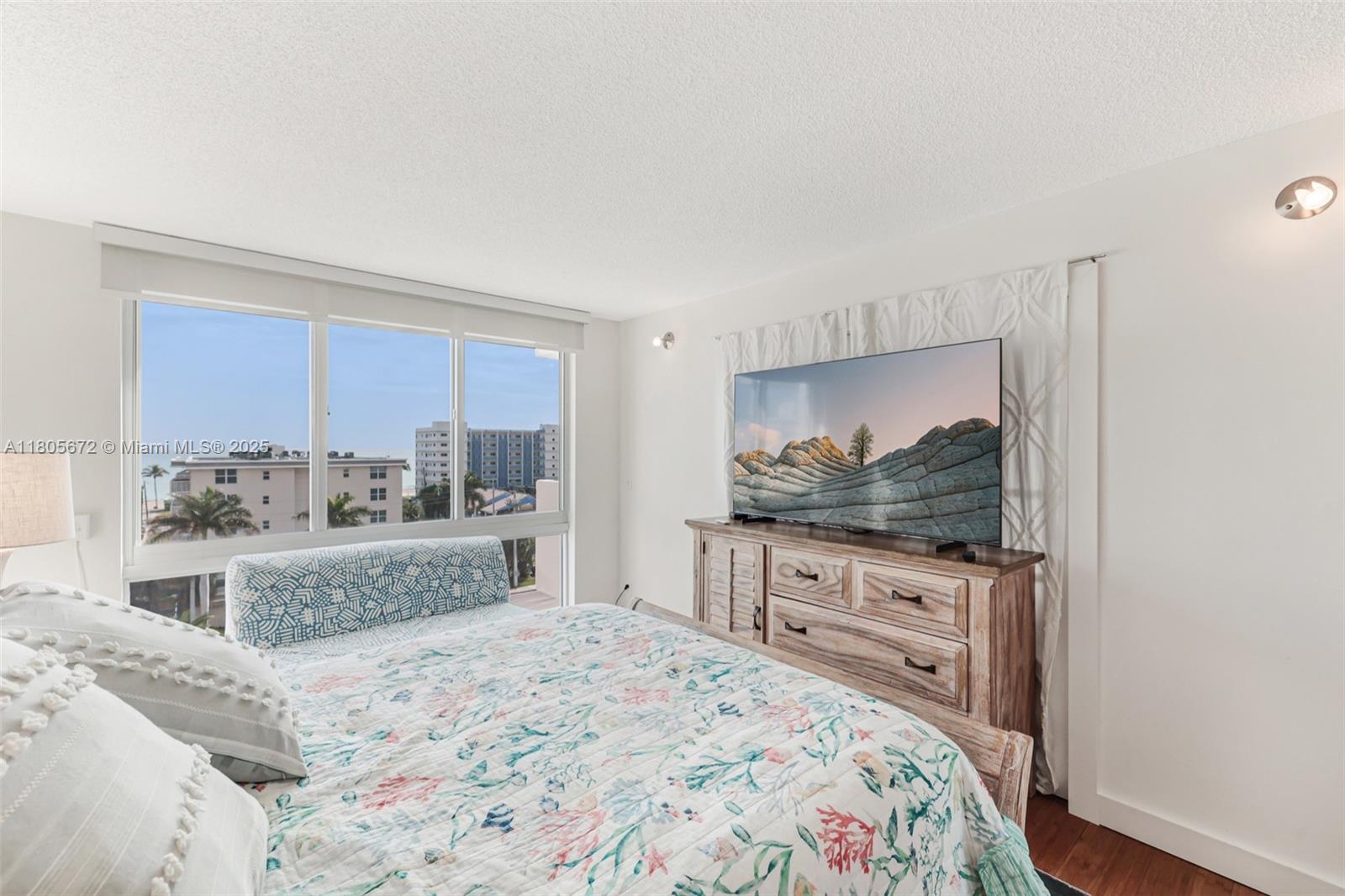 1500 South Ocean Drive, Unit 7J Hollywood, FL 33019 - Photo 29 of 54 a bedroom with a bed and a flat screen tv