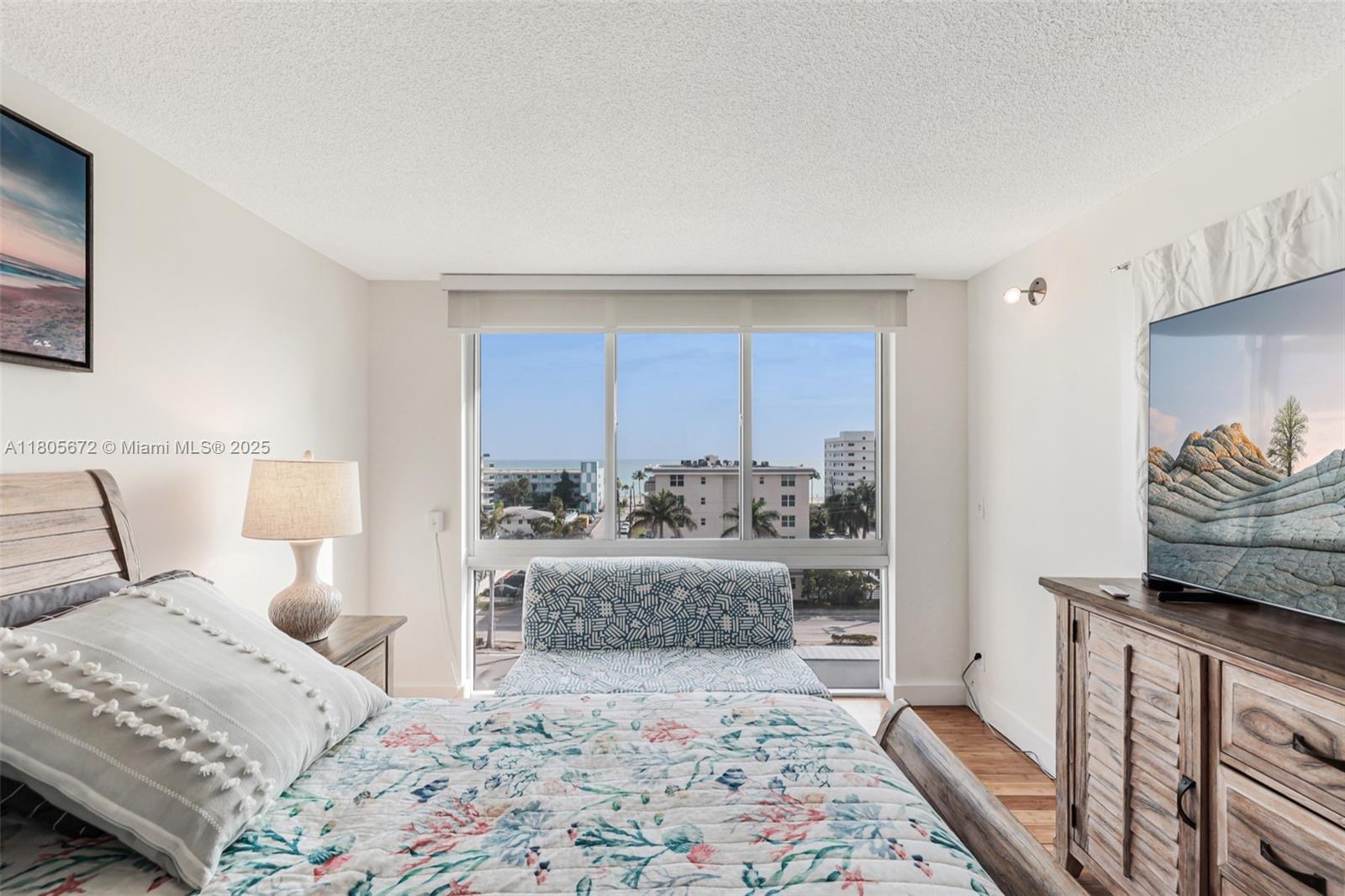 1500 South Ocean Drive, Unit 7J Hollywood, FL 33019 - Photo 30 of 54 a bedroom with a large bed and a window