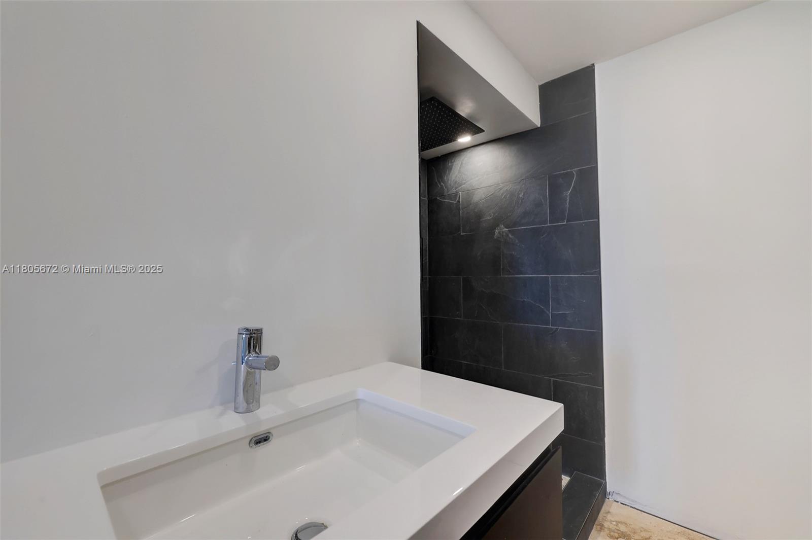 1500 South Ocean Drive, Unit 7J Hollywood, FL 33019 - Photo 32 of 54 a bathroom with a sink and vanity