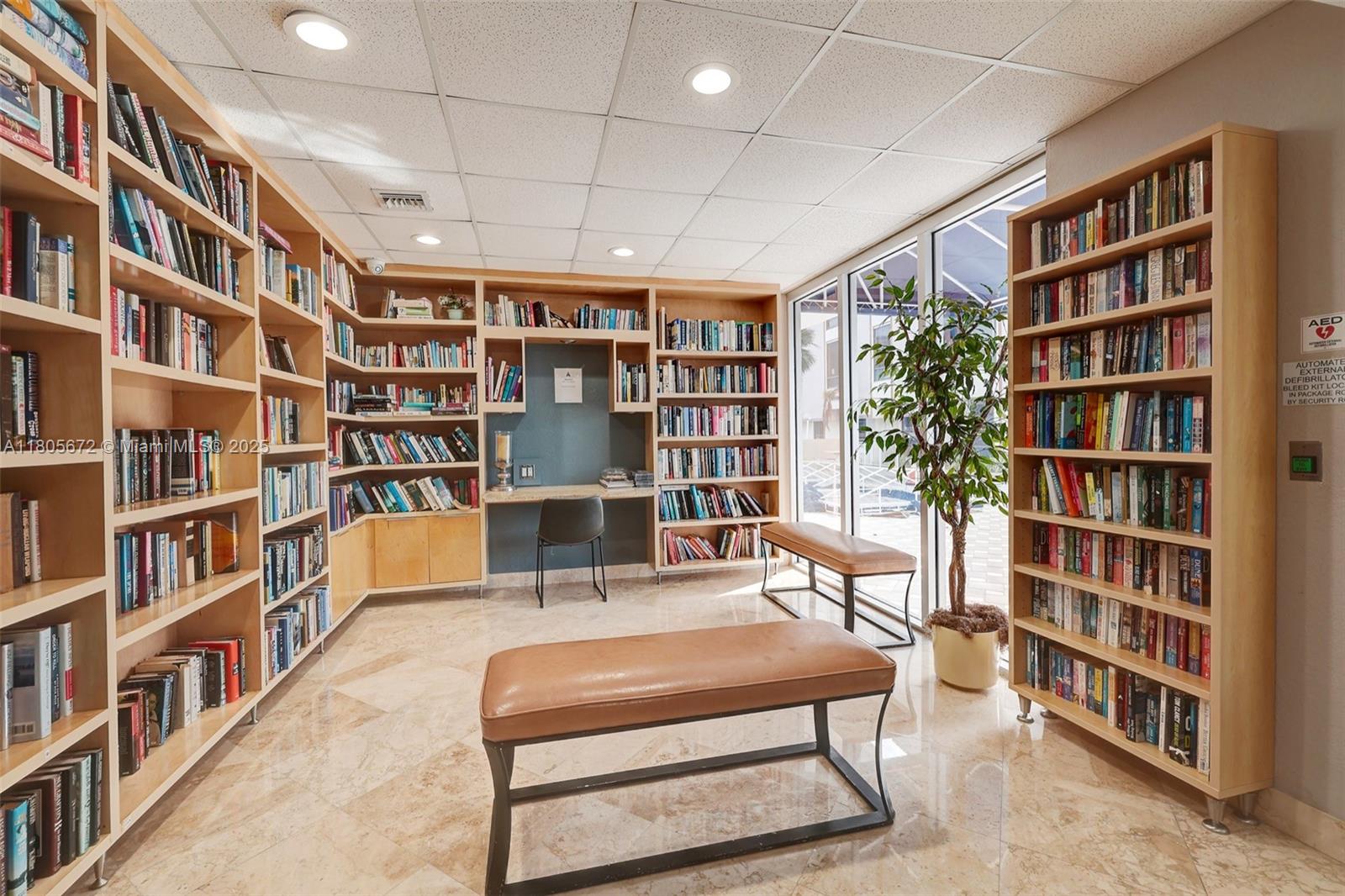 1500 South Ocean Drive, Unit 7J Hollywood, FL 33019 - Photo 41 of 54 a living room with furniture and a book shelf