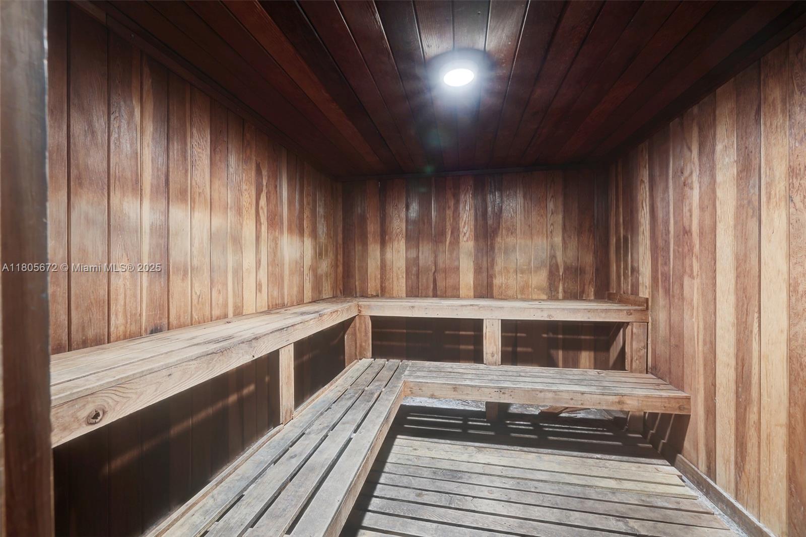 1500 South Ocean Drive, Unit 7J Hollywood, FL 33019 - Photo 44 of 54 a kitchen with wooden cabinets and a stove