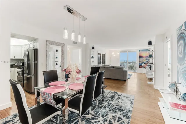 a dining room with furniture and wooden floor