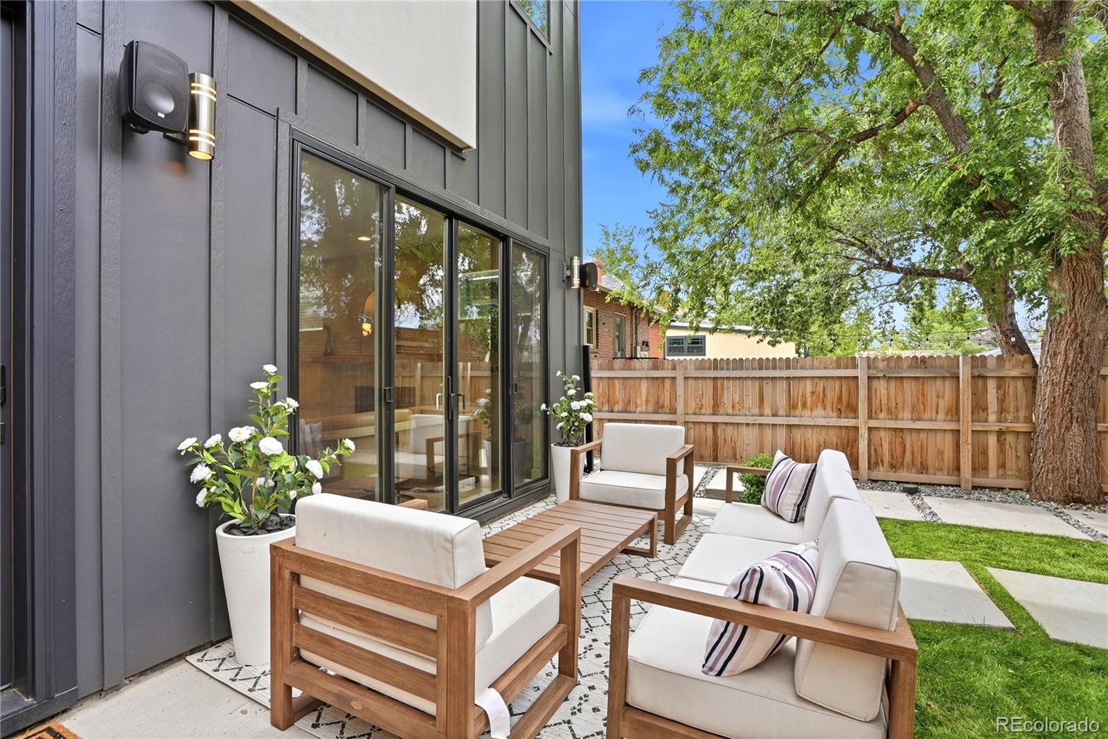 245 South Emerson Street Denver, CO 80209 - Photo 23 of 49 a view of a patio with couches chairs and a potted plant