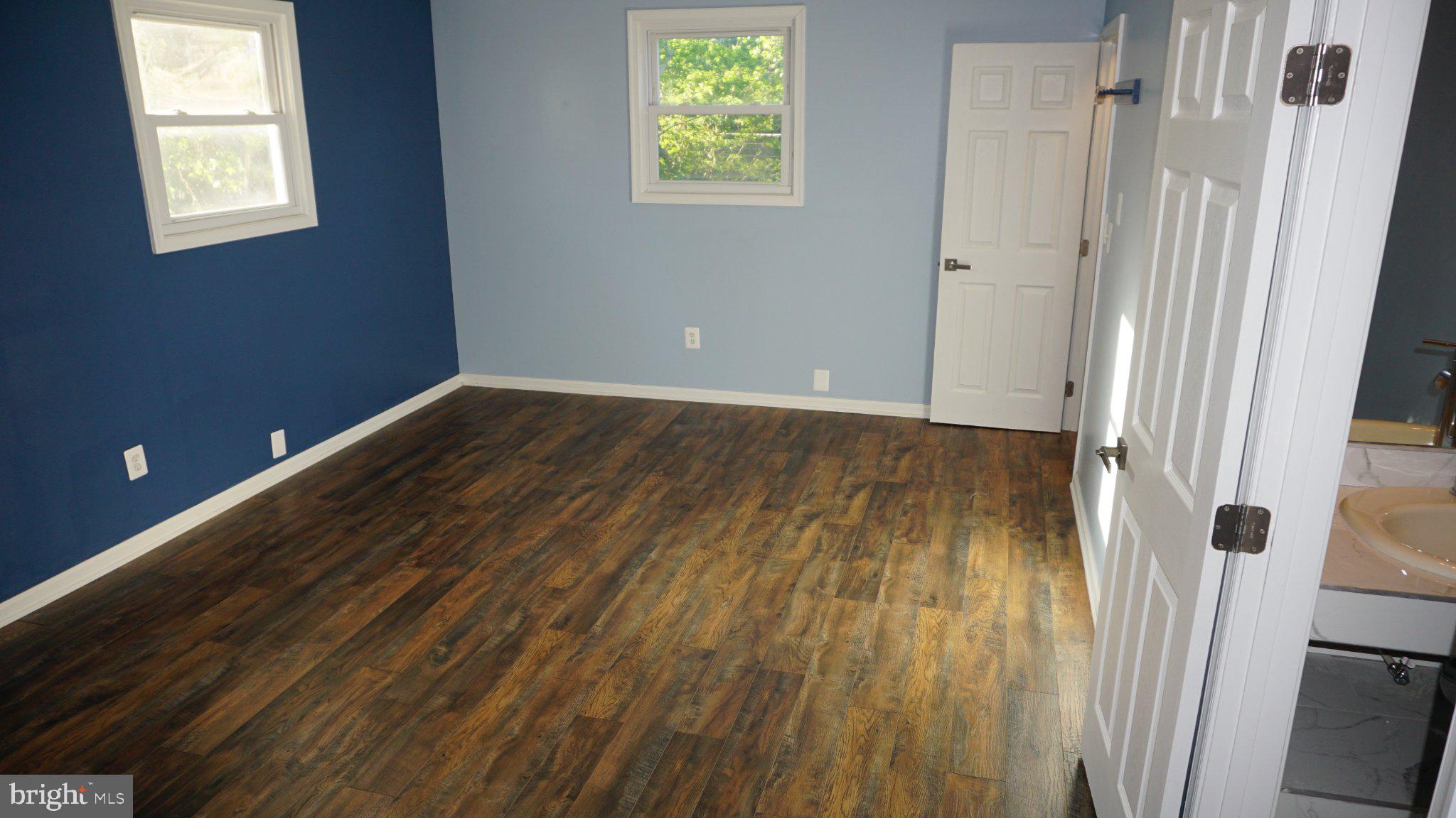 5854 Deale Churchton Road Deale, MD 20751 - Photo 56 of 57 Bright and airy room with blue accents.