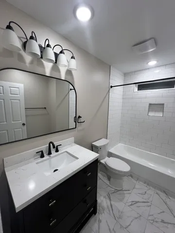 a bathroom with a sink double vanity and a mirror