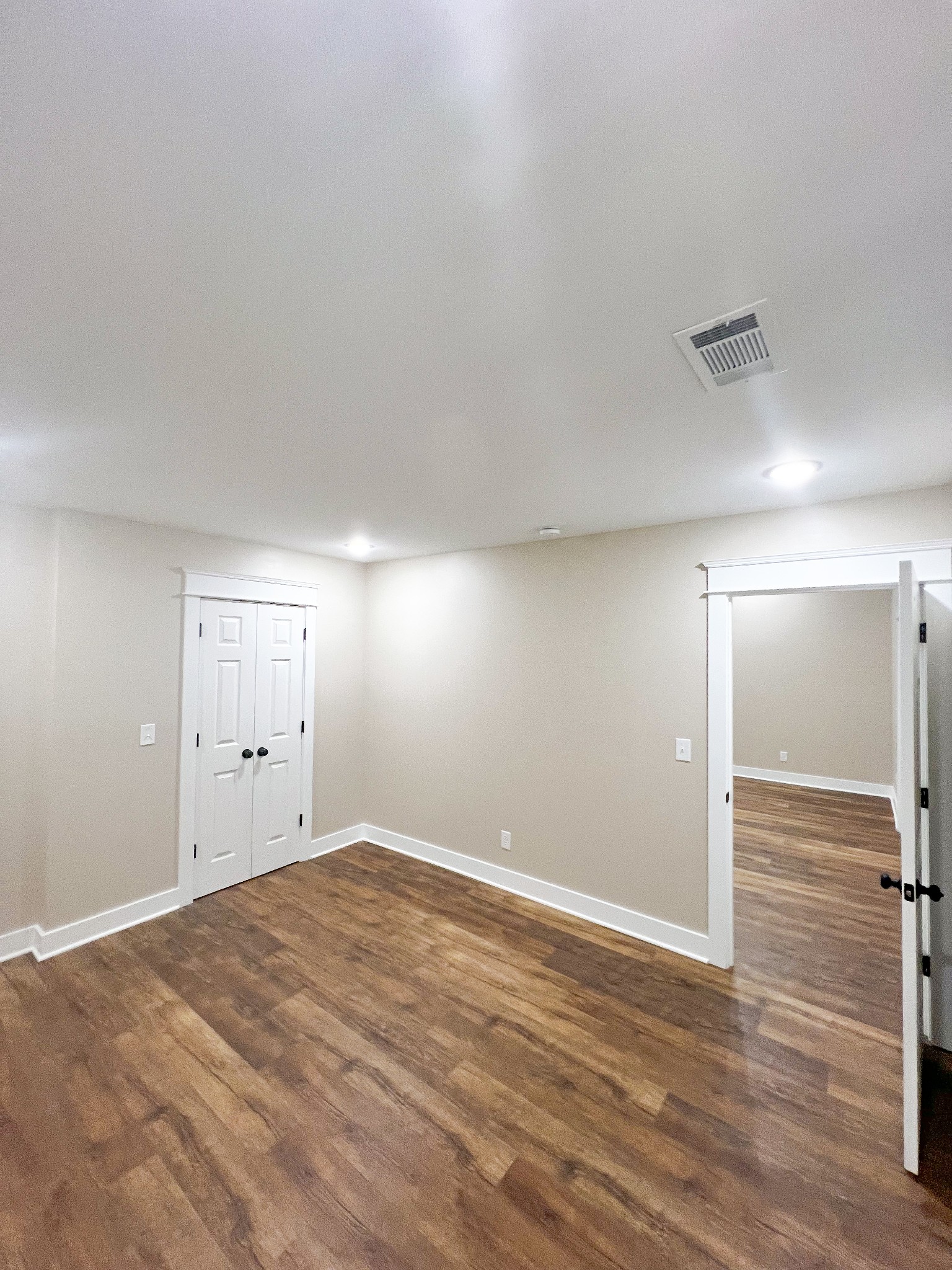 107 1st Avenue, Unit A Murfreesboro, TN 37130 - Photo 6 of 7 an empty room with wooden floor and windows
