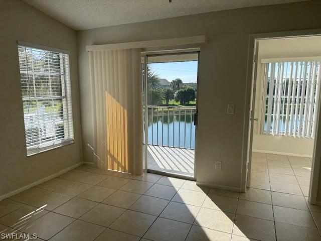 153 Santa Clara Drive, Unit 10 Naples, FL 34104 - Photo 2 of 33 a view of an empty room with a window