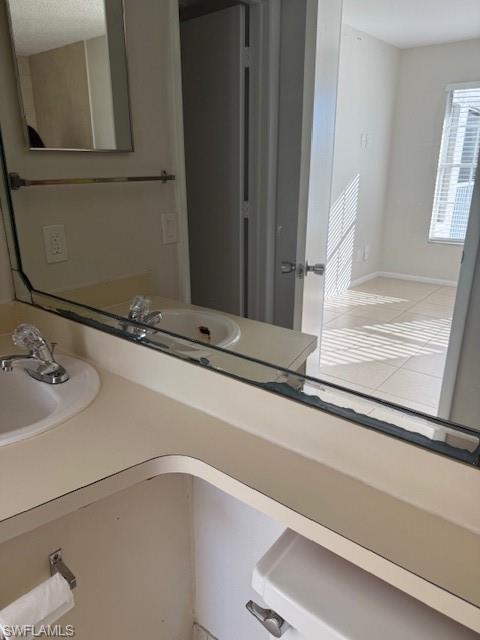 153 Santa Clara Drive, Unit 10 Naples, FL 34104 - Photo 27 of 33 a bathroom with a sink and a mirror