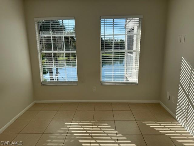 153 Santa Clara Drive, Unit 10 Naples, FL 34104 - Photo 29 of 33 a view of a room that has a window in it