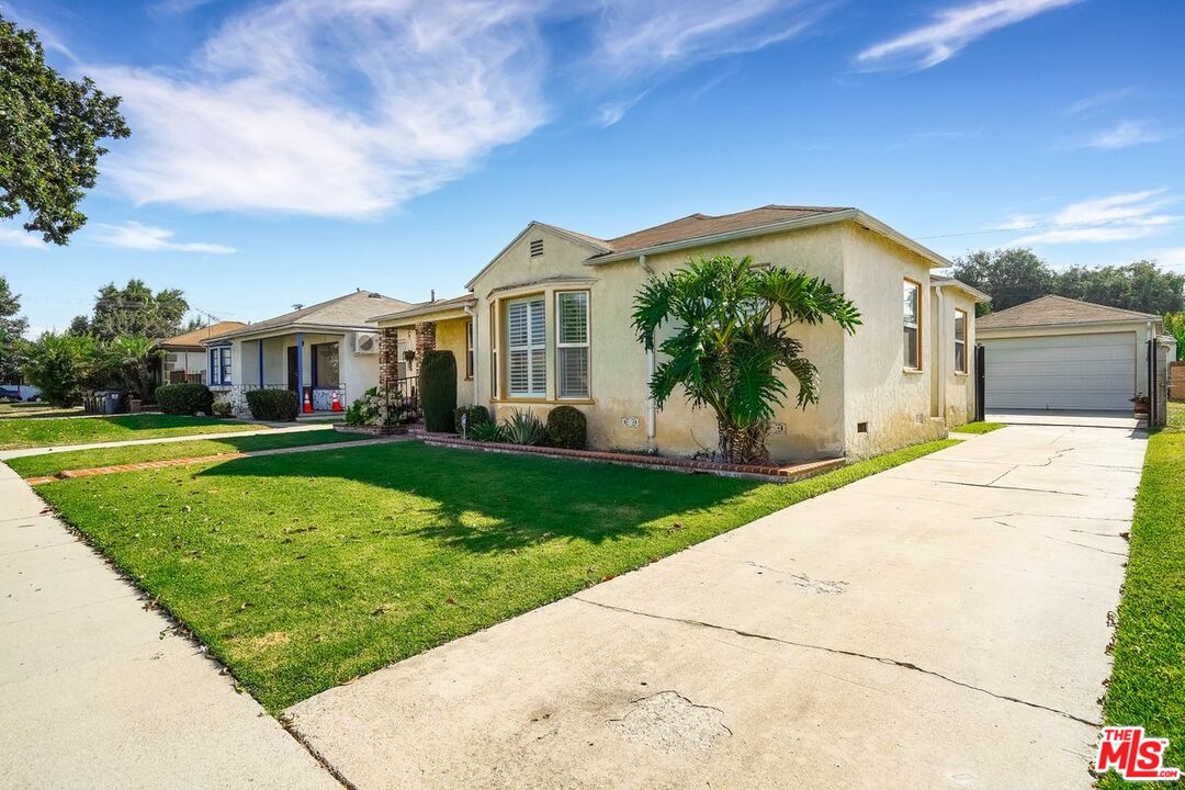 1316 South Castlegate Avenue Compton, CA 90221 - Photo 1 of 28 a house view with a garden space