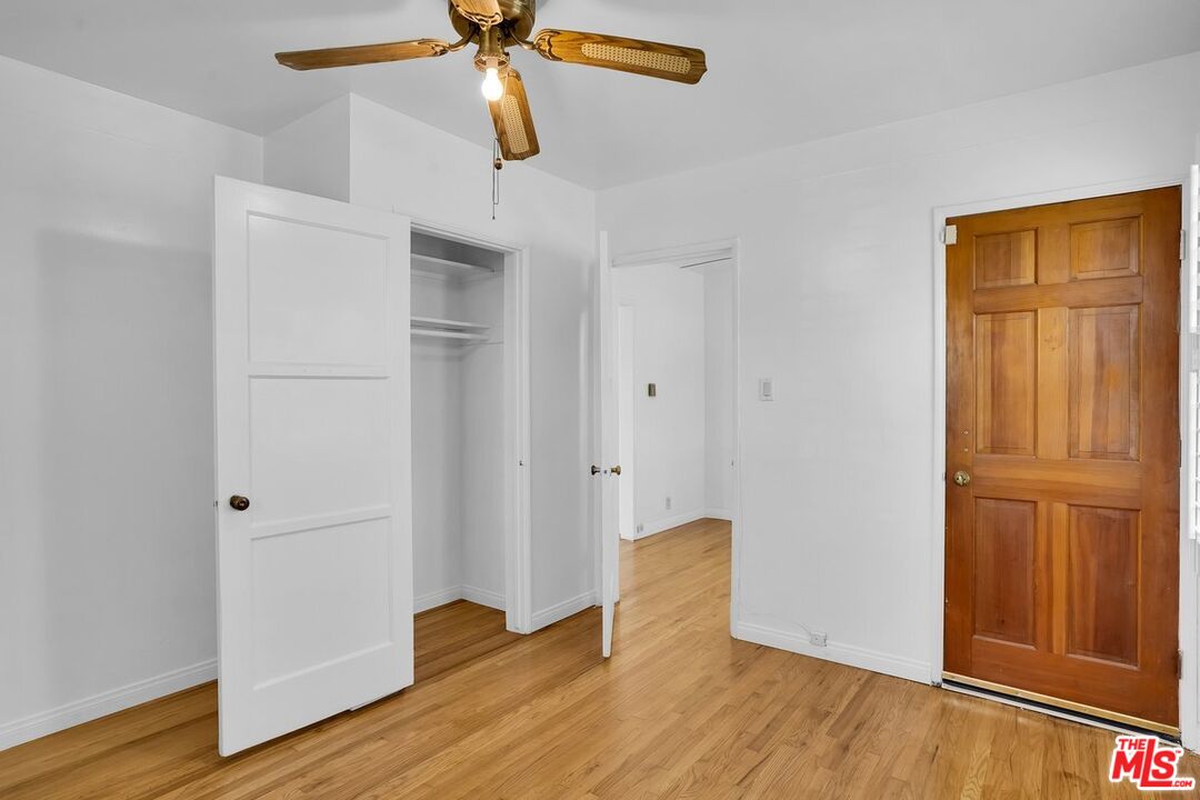 1316 South Castlegate Avenue Compton, CA 90221 - Photo 11 of 28 a view of a room with wooden floor and closet area