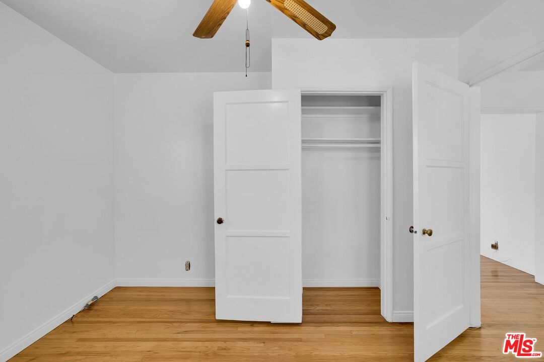 1316 South Castlegate Avenue Compton, CA 90221 - Photo 12 of 28 a view of empty room with wooden floor